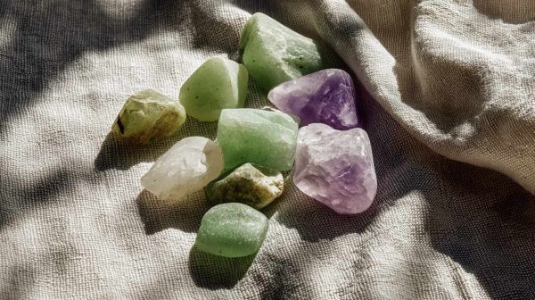 Close-up of a small, natural jadeite stone with varied colors