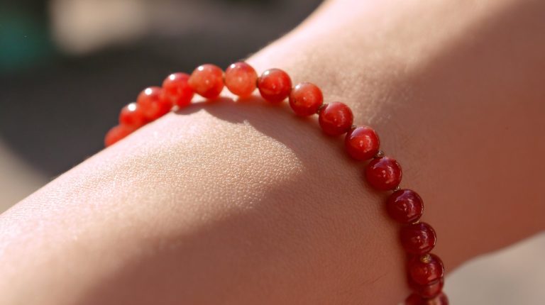 Vibrant red jade bracelet on a wrist