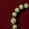 Pulsera de sabiduría con semillas de Bodhi, pata de gato y dije Om Mani Padme Hum Bodhi Seed Cat Paw Wisdom Bracelet with Om Mani Padme Hum Charm