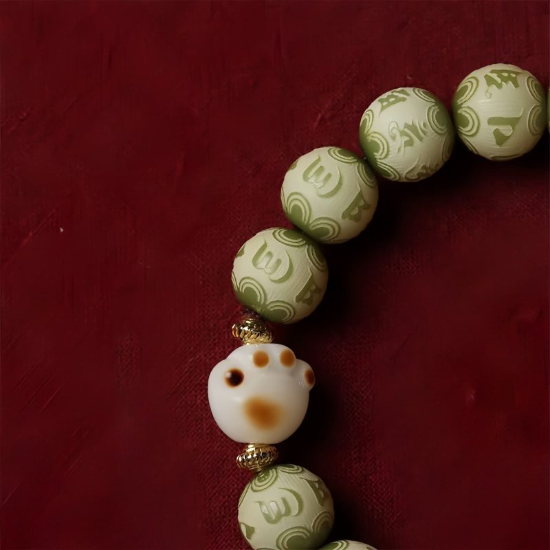 Pulsera de sabiduría con semillas de Bodhi, pata de gato y dije Om Mani Padme Hum Bodhi Seed Cat Paw Wisdom Bracelet with Om Mani Padme Hum Charm