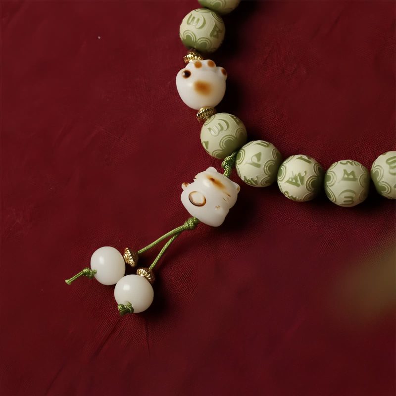 Pulsera de sabiduría con semillas de Bodhi, pata de gato y dije Om Mani Padme Hum Bodhi Seed Cat Paw Wisdom Bracelet with Om Mani Padme Hum Charm