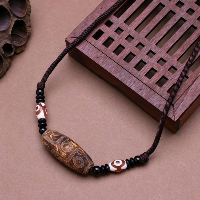 قلادة حماية من حجر dzi التبتي ذي التسع عيون Agate Tibetan Dzi Bead Protection Necklace