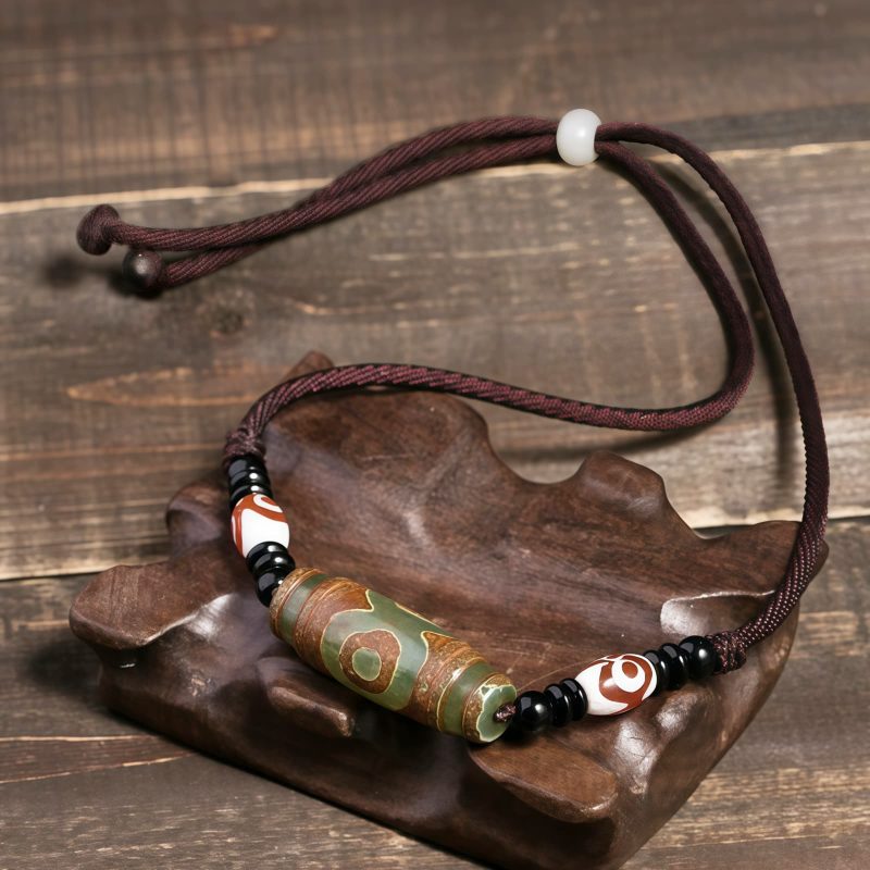 قلادة حماية من حجر dzi التبتي ذي التسع عيون Agate Tibetan Dzi Bead Protection Necklace