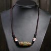 قلادة حماية من حجر dzi التبتي ذي التسع عيون Agate Tibetan Dzi Bead Protection Necklace