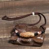 قلادة حماية من حجر dzi التبتي ذي التسع عيون Agate Tibetan Dzi Bead Protection Necklace