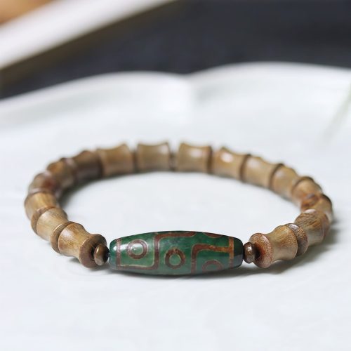 Pulsera de Paz de Sándalo con Dzi de Nueve Ojos Tibetano Pulsera de Paz de Sándalo con Dzi de Nueve Ojos Tibetano