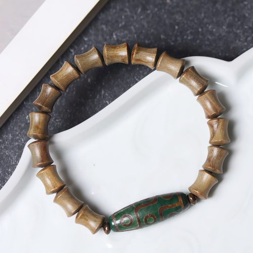 Pulsera de Paz de Sándalo con Dzi de Nueve Ojos Tibetano Pulsera de Paz de Sándalo con Dzi de Nueve Ojos Tibetano