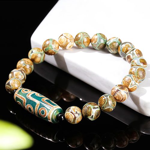 Pulsera Tibetana de Abundancia con Dzi de Nueve Ojos y Sándalo Pulsera Tibetana de Abundancia con Dzi de Nueve Ojos y Sándalo