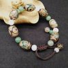 チベット三眼天珠プロテクションブレスレット Tibetan Three-Eyed Dzi Bead Protection Bracelet