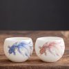 كوب شاي سيراميك أبيض مزخرف بأسماك الكوي White Ceramic Koi Fish Teacup