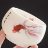 كوب شاي سيراميك أبيض مزخرف بأسماك الكوي White Ceramic Koi Fish Teacup