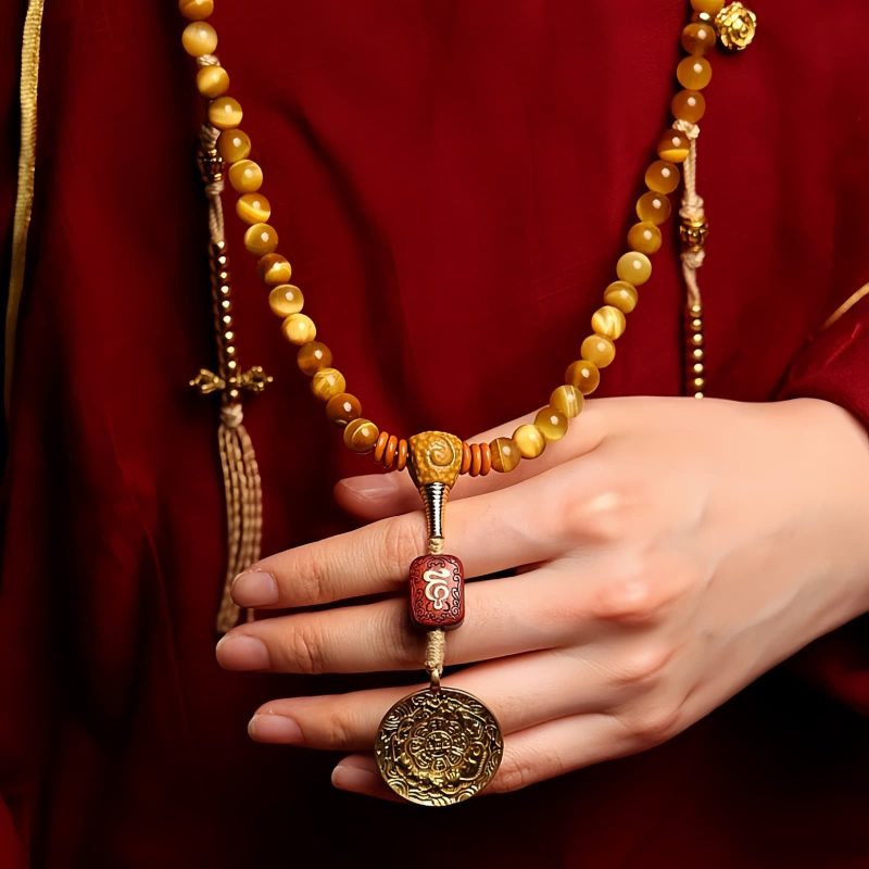 سوار يد من خرز مالا 108 حبة من عين النمر مع شرابة دورجي 108 Mala Beads Tiger Eye Dorje Tassel Bracelet