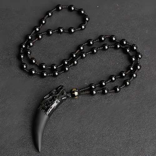 Collar con Diente de Lobo de Obsidiana Negra Natural: Amuleto de Valentía Collar con Diente de Lobo de Obsidiana Negra Natural: Amuleto de Valentía